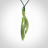 This photo shows a hook with koru pendant carved from New Zealand Jade. We provide this piece with an adjustable Manuka Green cord.